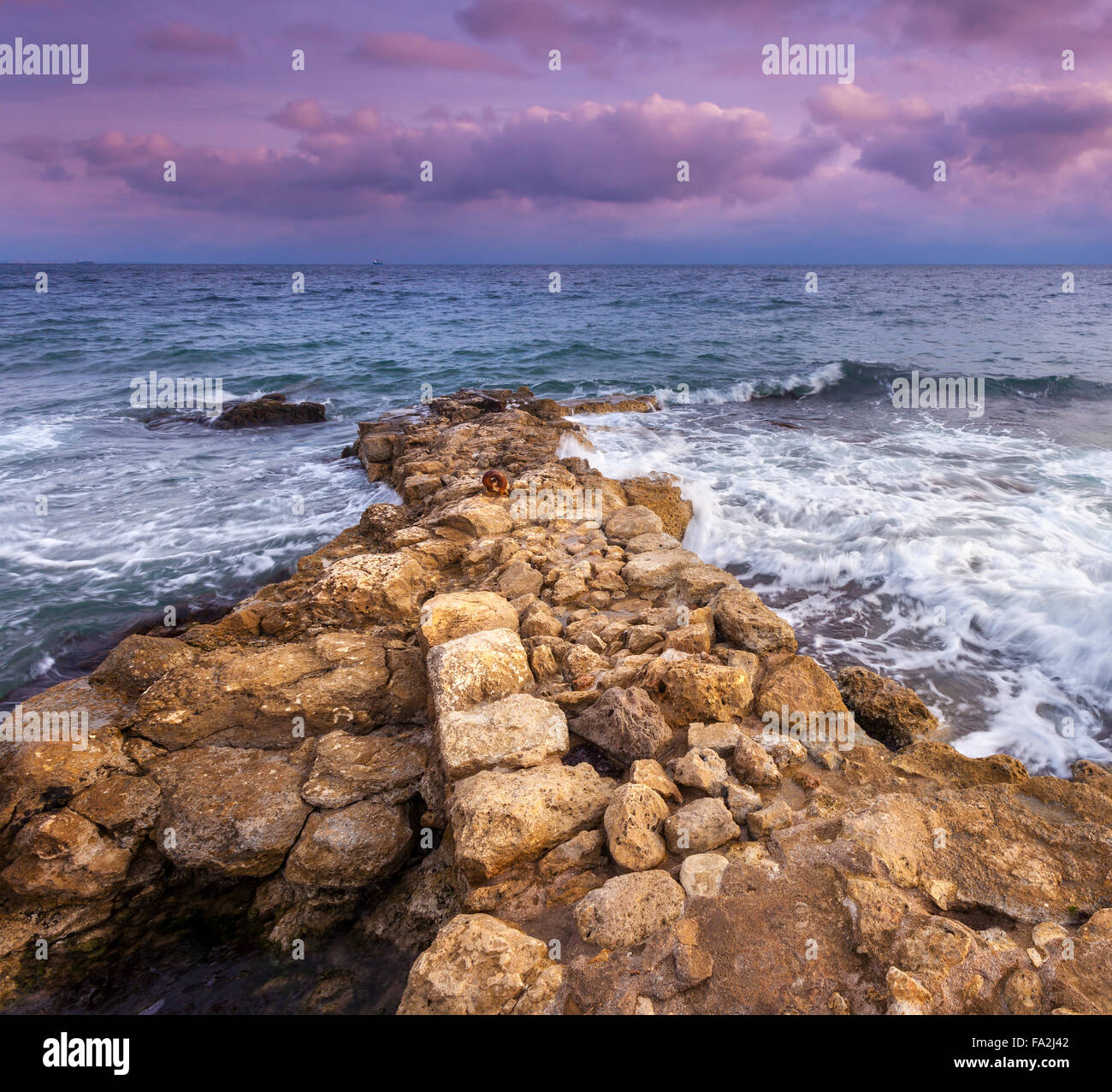 Sea waves with rocks on the beach at sunset. Beautiful landscape Stock ...