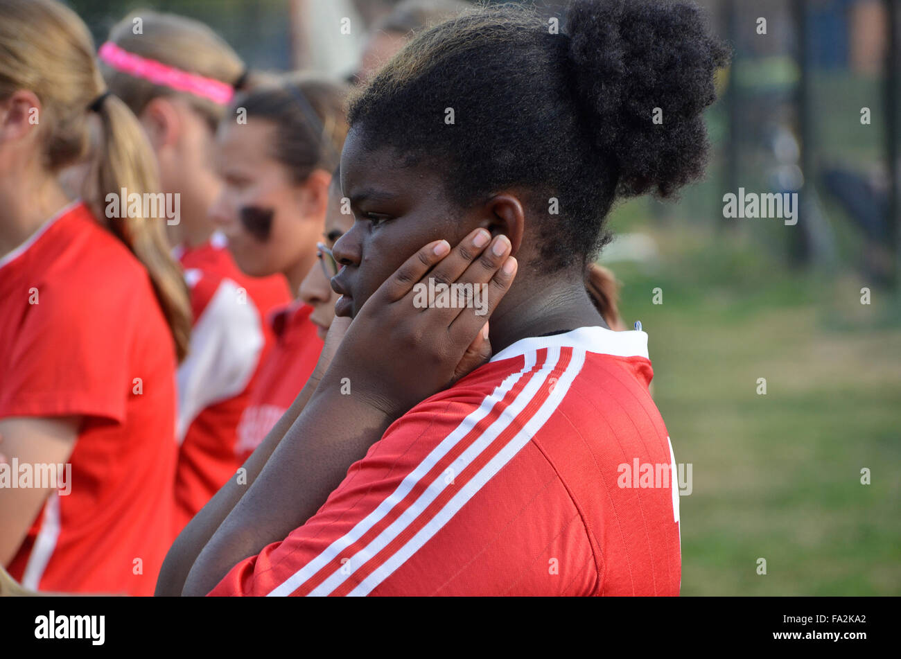 Soccer team player shows her concern over the way the game is going Stock Photo
