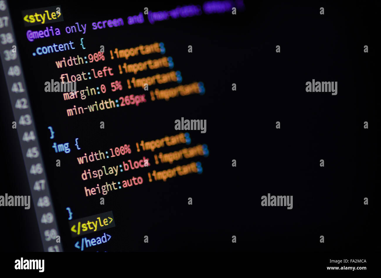 Close-up of media query, HTML and CSS code of web page displayed on a computer monitor Stock Photo