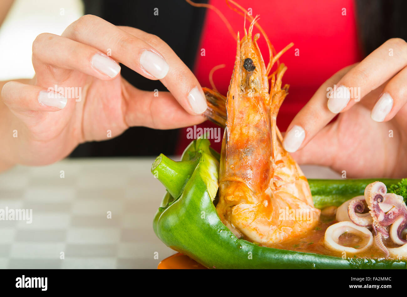 Woman eating a shrimp hi-res stock photography and images - Alamy
