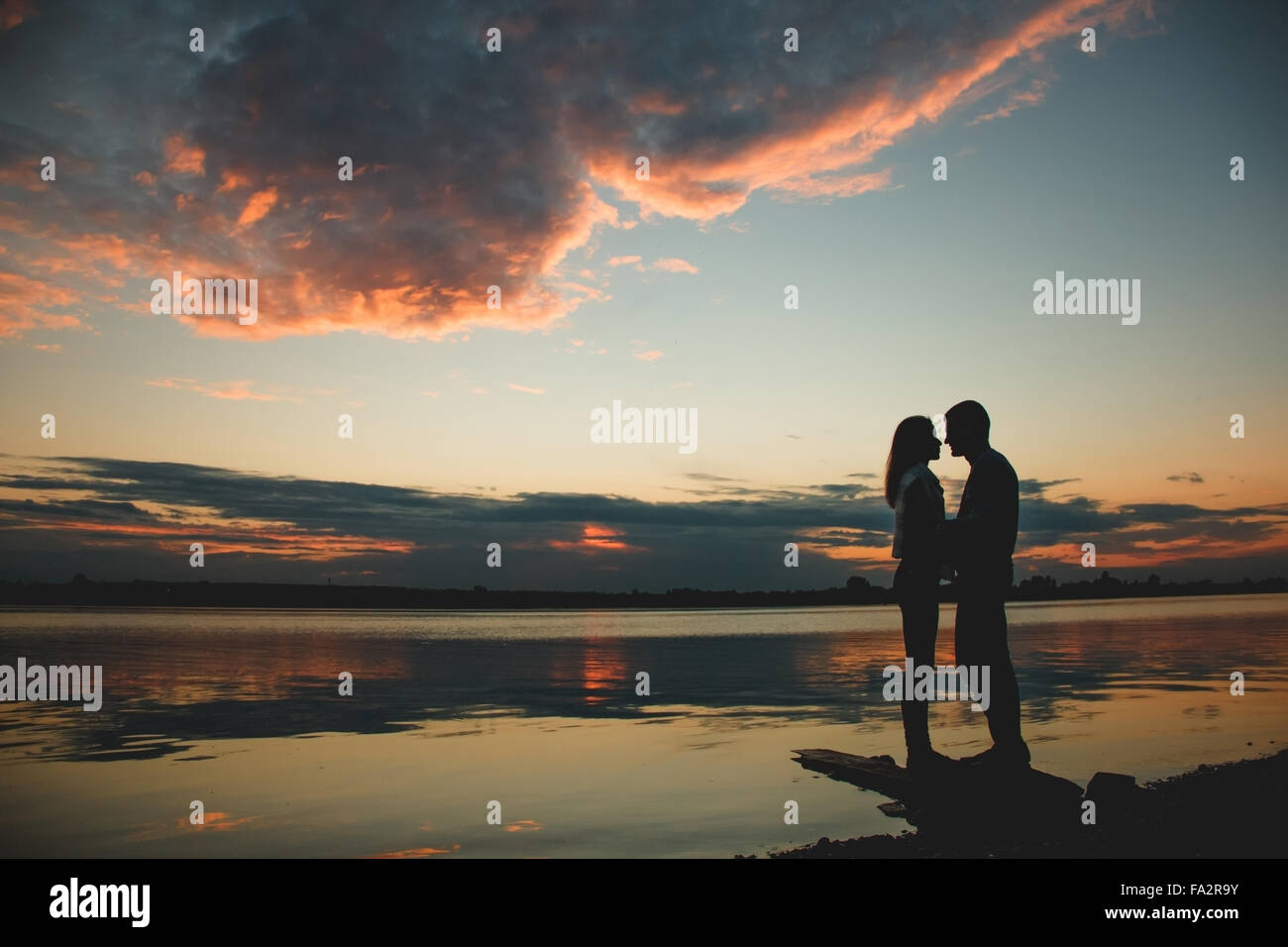 silhouette of romantic couple in the park - outdoors Stock Photo - Alamy