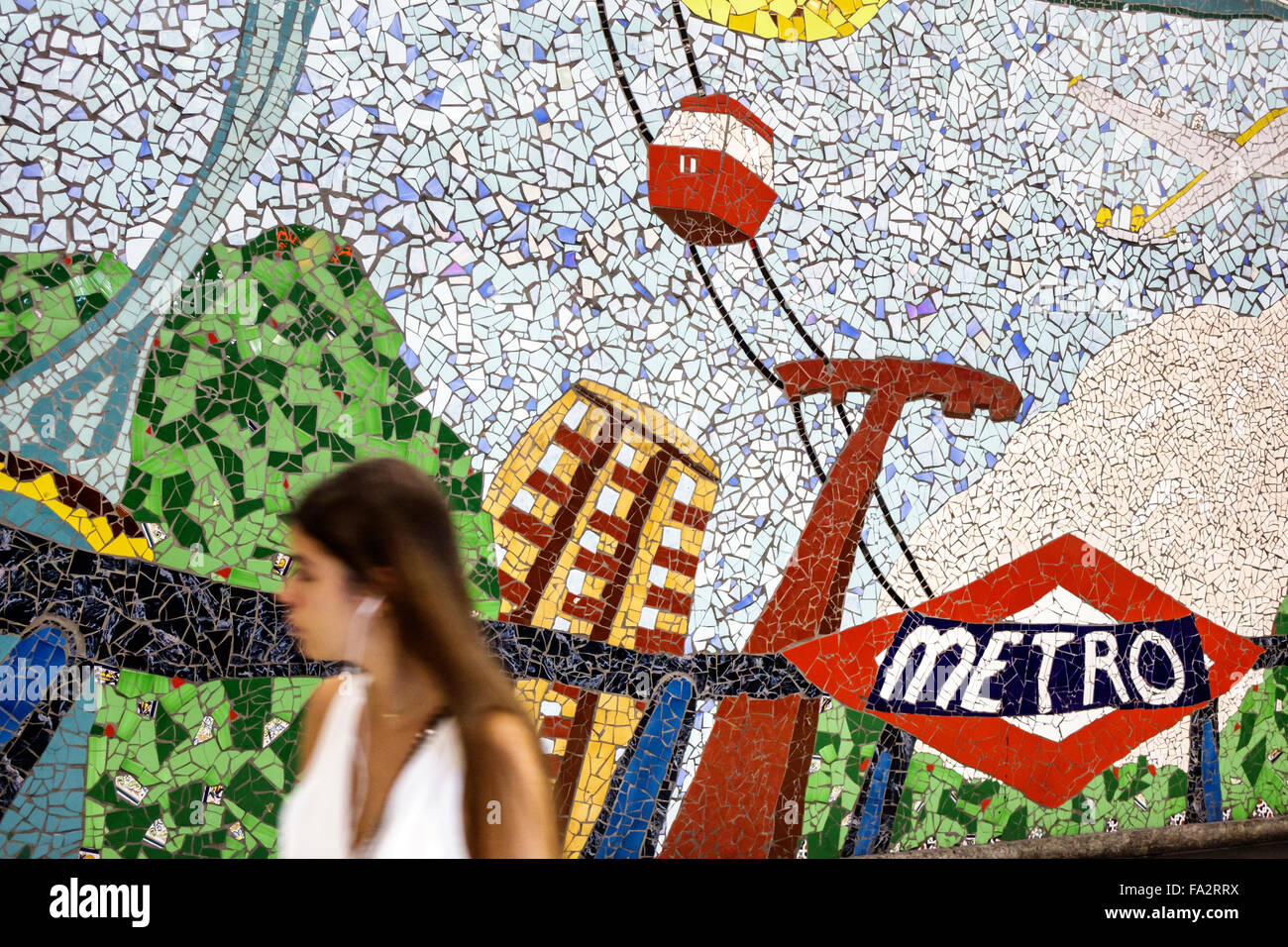 Madrid Spain,Hispanic Moncloa-Aravaca,Arguelles Metro Station,subway,train,mosaic tile mural,art,teen teens teenager teenagers girl girls,youngster,fe Stock Photo