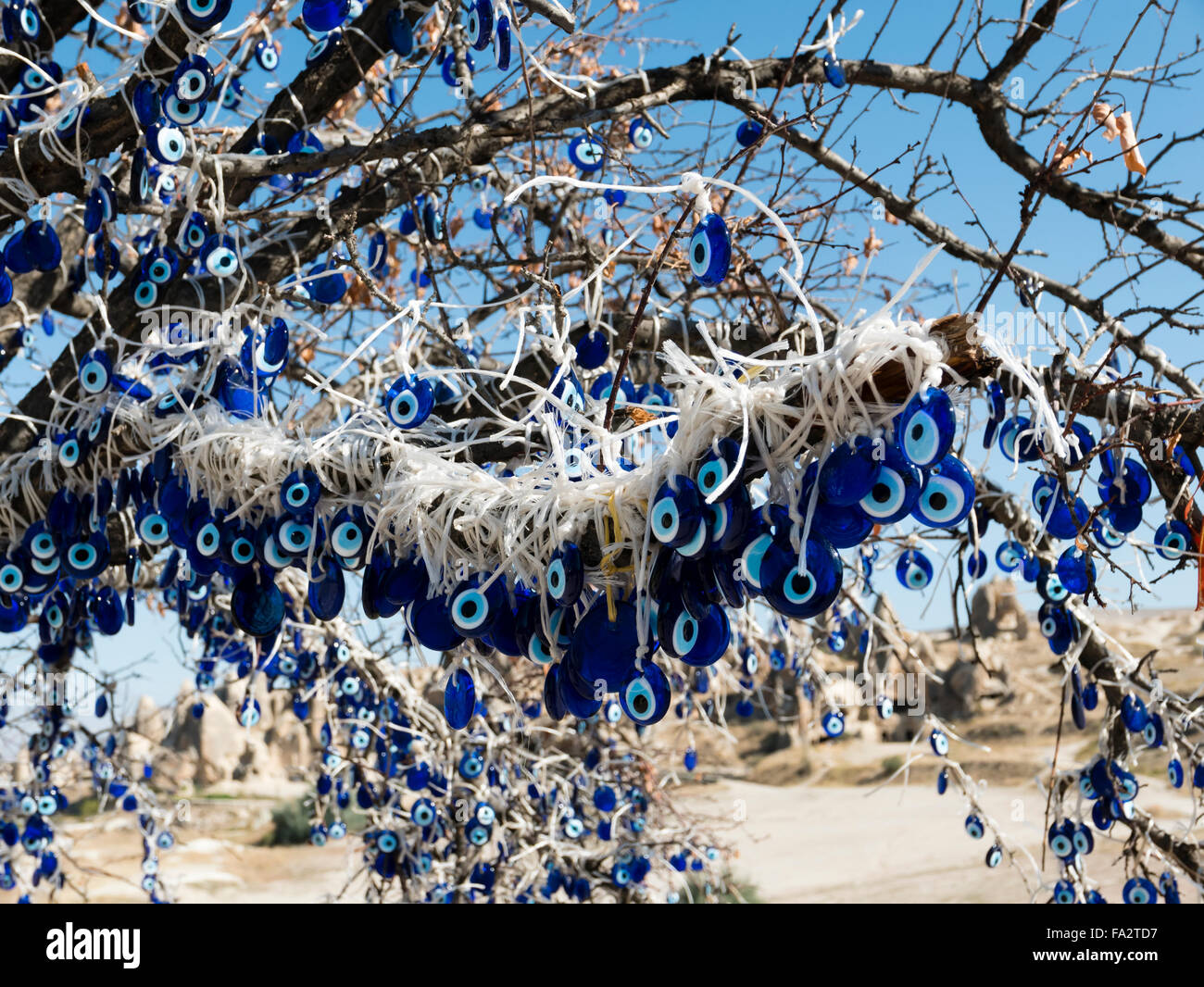 Tree decorated with evil eye amulets, Goreme, Cappadocia, Central Anatolia, Turkey. Stock Photo