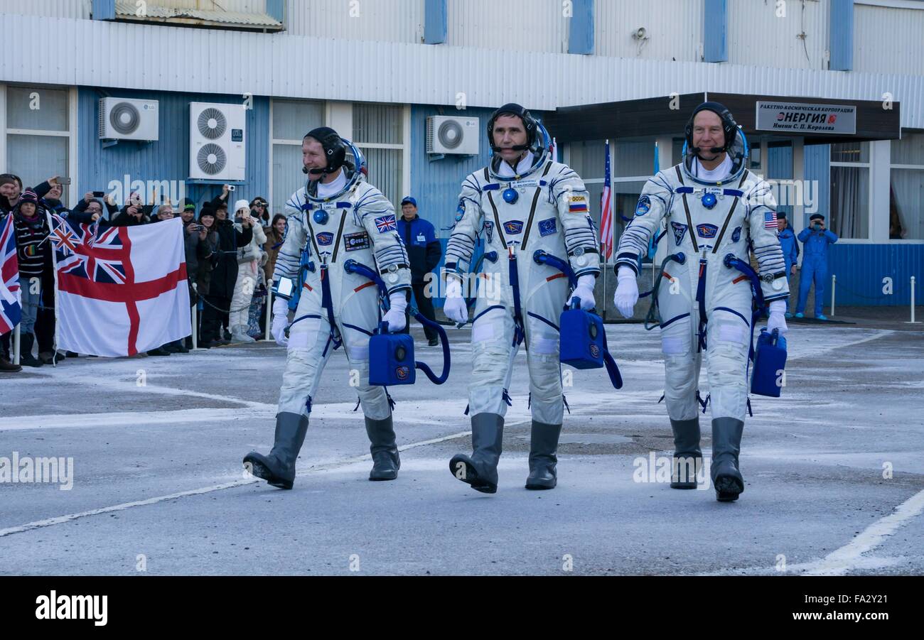 International Space Station Expedition 46 crew members depart Building 254 to launch onboard the Soyuz TMA-19M spacecraft December 15, 2015 in Baikonur, Kazakhstan. Crew (L-R): British astronaut Tim Peake of European Space Agency, Russian Soyuz Commander Yuri Malenchenko and American astronaut Tim Kopra. Stock Photo