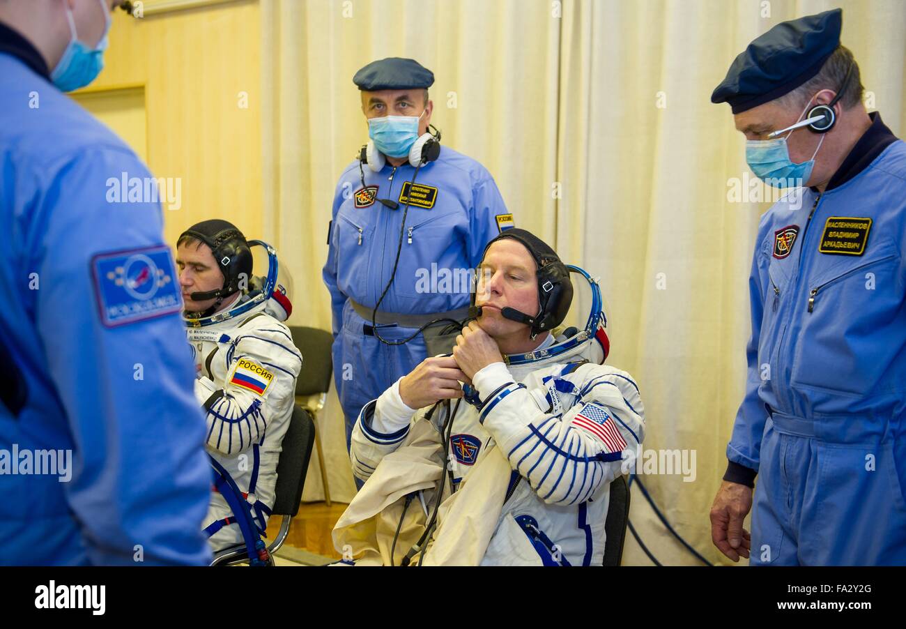 International Space Station Expedition 46 crew member American astronaut Tim Kopra has his Russian Sokol space suits adjusted in Building 254 before launch onboard the Soyuz TMA-19M spacecraft December 15, 2015 in Baikonur, Kazakhstan. Stock Photo