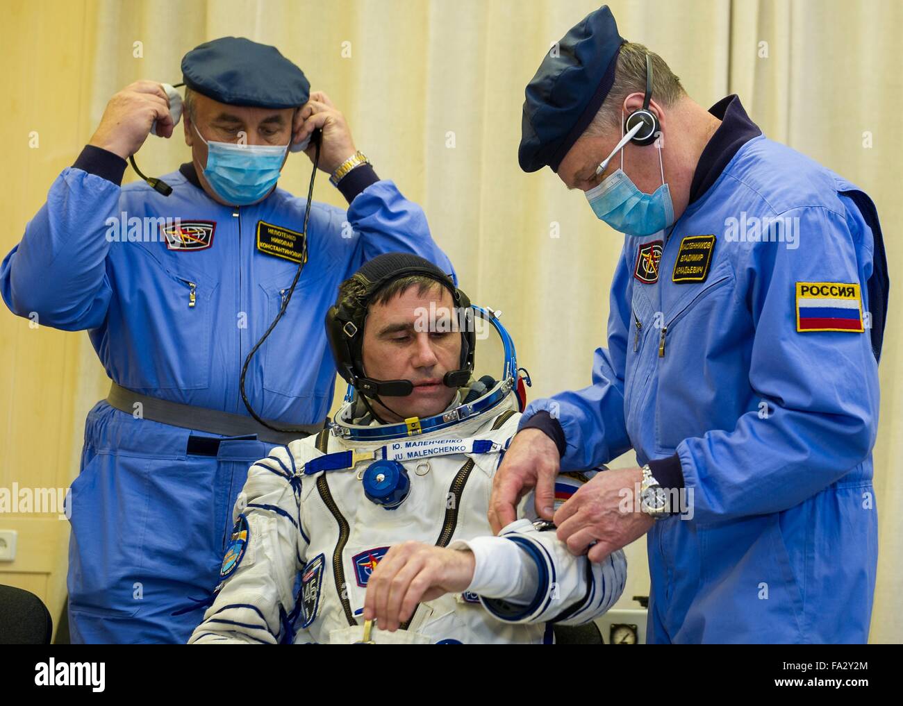 International Space Station Expedition 46 crew member Soyuz Commander Russian Yuri Malenchenko has his Sokol space suits adjusted in Building 254 before launch onboard the Soyuz TMA-19M spacecraft December 15, 2015 in Baikonur, Kazakhstan. Stock Photo