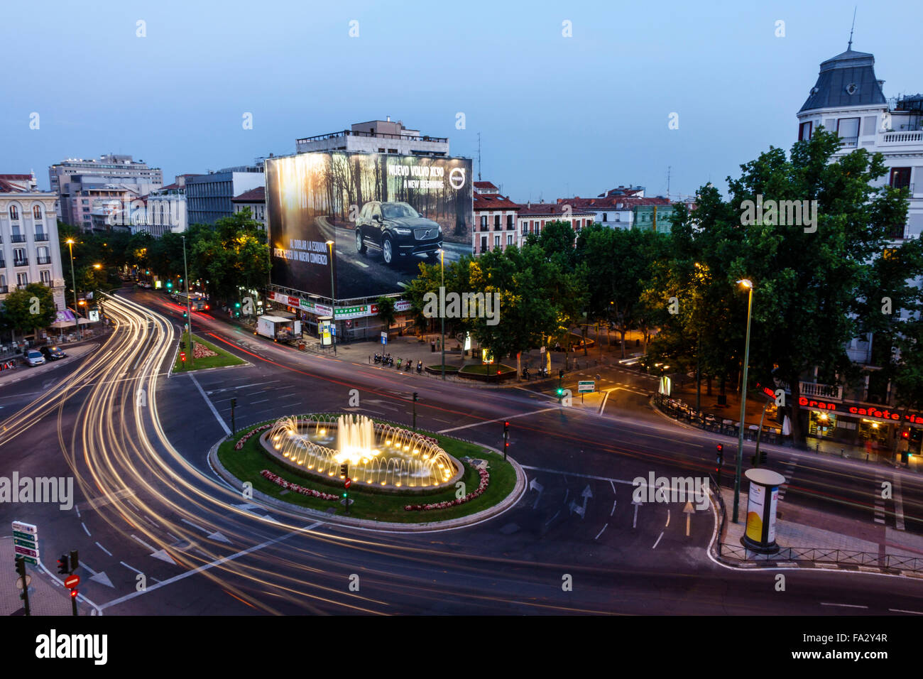 Madrid Spain,Hispanic Centro,Chamberi,Plaza Alonzo Martinez,dusk,night evening,time exposure,traffic circle,fountain,lighted,Spain150706103 Stock Photo