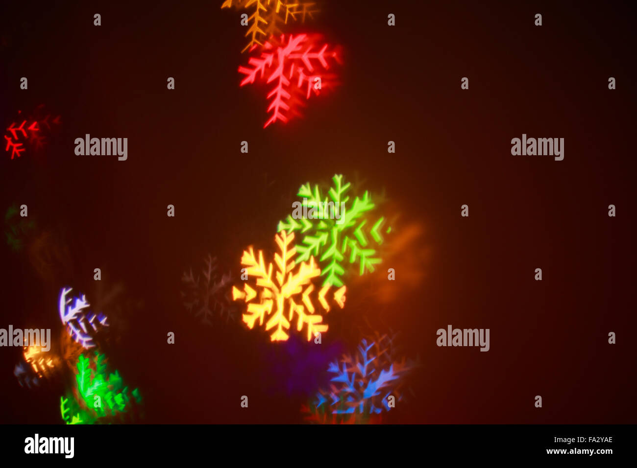 high quality snowflake light leak.. on dark background Stock Photo - Alamy