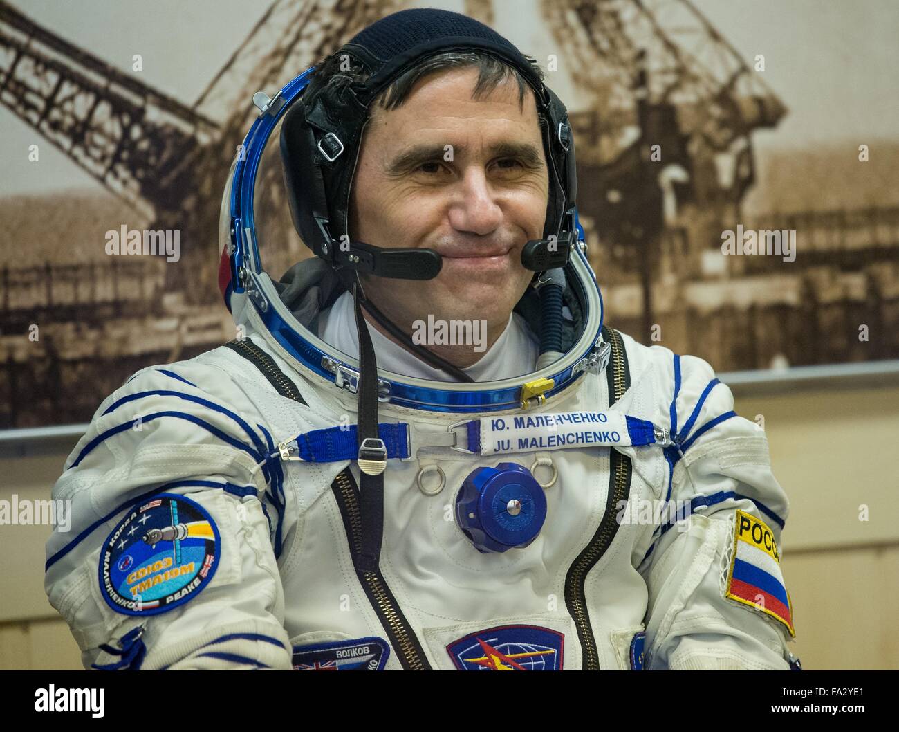 International Space Station Expedition 46 crew member Russian Soyuz Commander Yuri Malenchenko smiles during the pressure check of his Sokol space suits adjusted in Building 254 before launch onboard the Soyuz TMA-19M spacecraft December 15, 2015 in Baikonur, Kazakhstan. Stock Photo