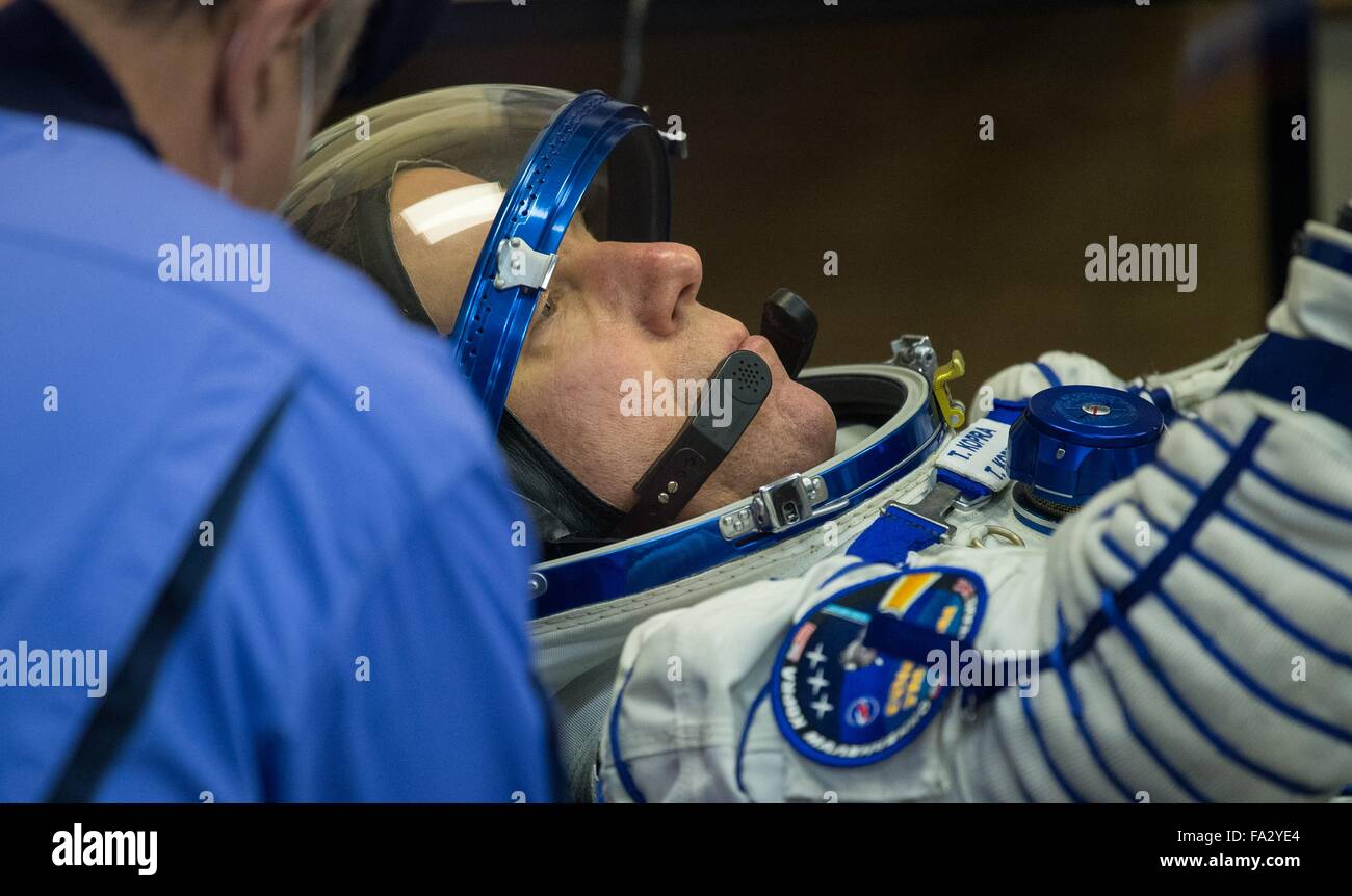 International Space Station Expedition 46 crew member American astronaut Tim Kopra has his Sokol space suits adjusted in Building 254 before launch onboard the Soyuz TMA-19M spacecraft December 15, 2015 in Baikonur, Kazakhstan. Stock Photo