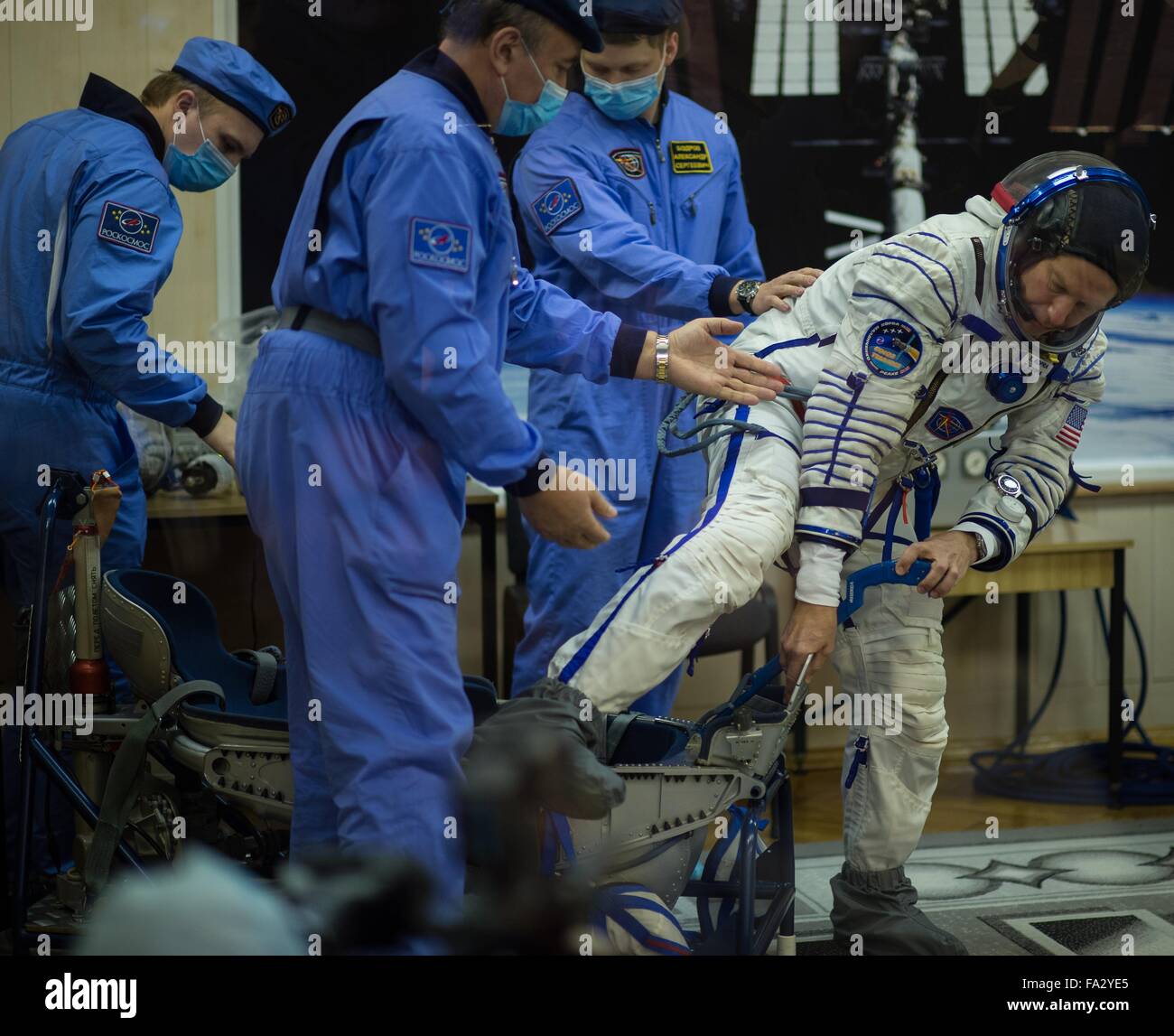 International Space Station Expedition 46 crew member American astronaut Tim Kopra has his Sokol space suits adjusted in Building 254 before launch onboard the Soyuz TMA-19M spacecraft December 15, 2015 in Baikonur, Kazakhstan. Stock Photo