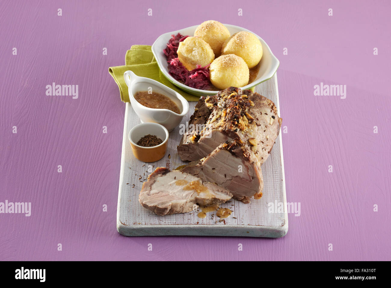 Pork roast with sauerkraut and dumplings + steps Stock Photo Alamy