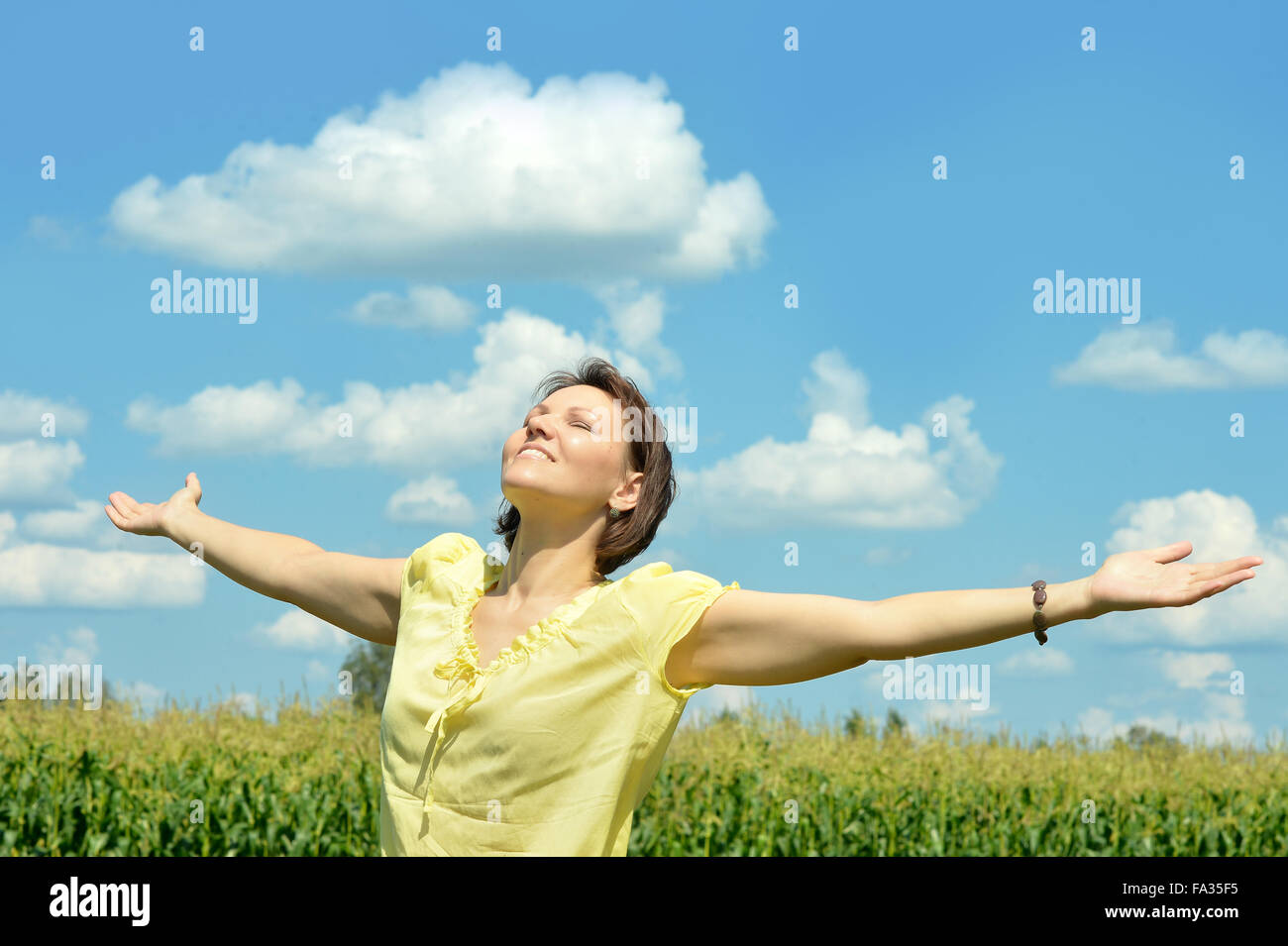 woman standing in the field Stock Photo - Alamy