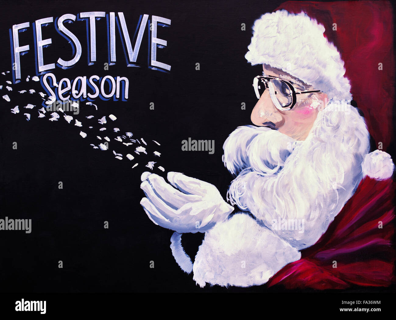 Festive season Santa Claus painted on board. Cotswolds, England Stock Photo