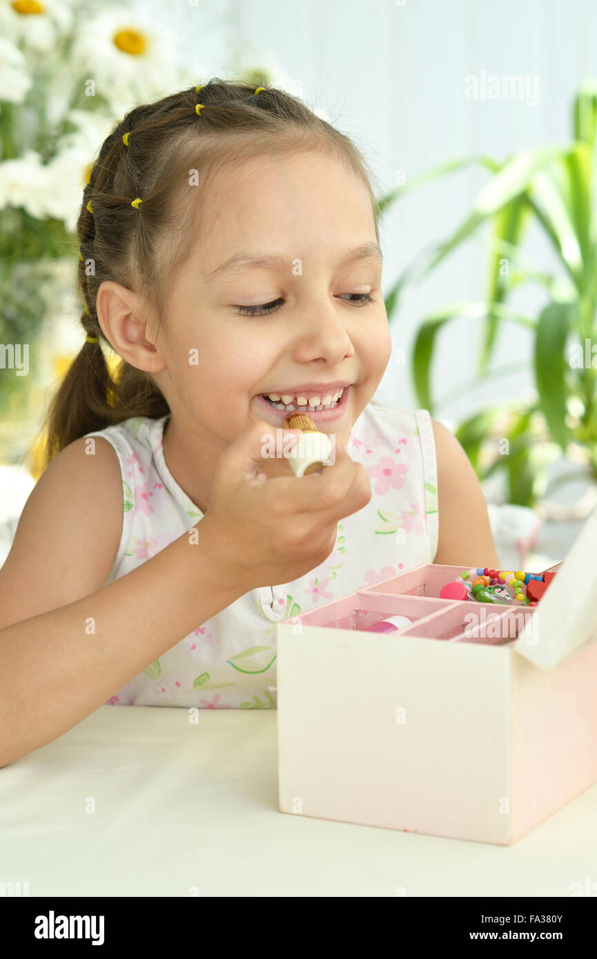 Beautiful little girl with lipstick Stock Photo Alamy