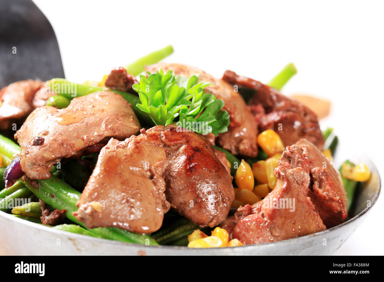 Panfried chicken livers with green beans and sweetcorn Stock Photo Alamy