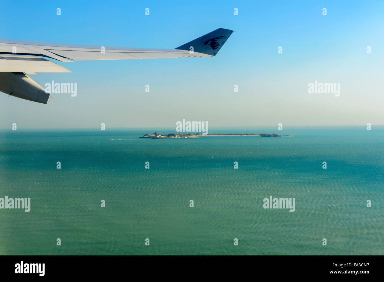 Aircraft in flight over the Maldives with Qatar Airways Stock Photo Alamy