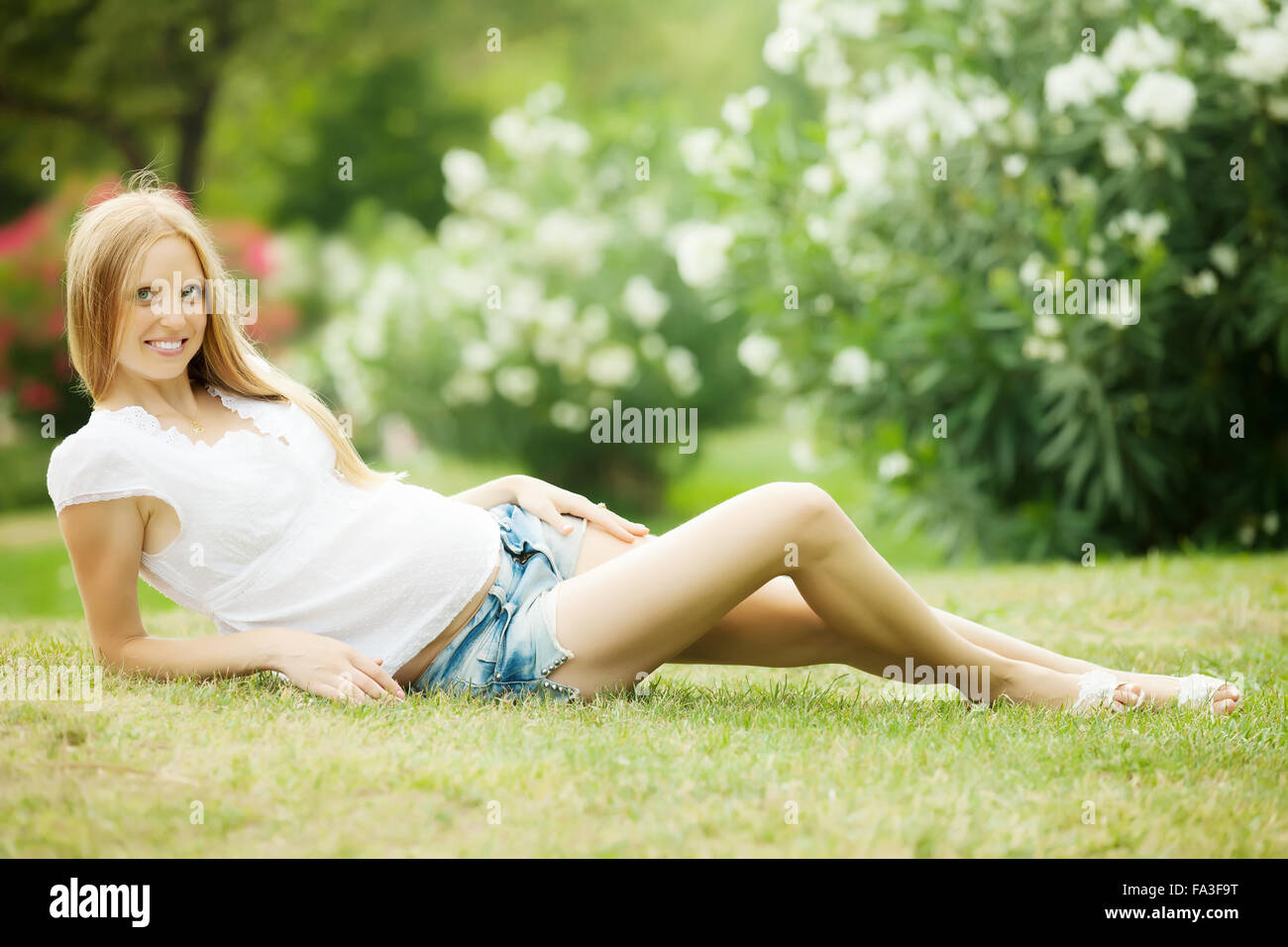 pregnant woman in summer park Stock Photo - Alamy