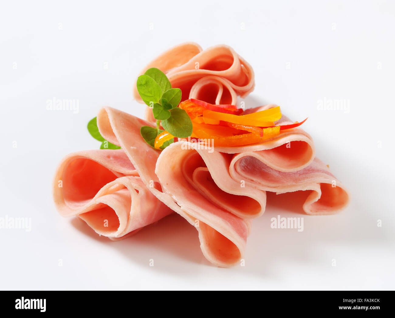 Thin slices of ham - studio shot Stock Photo - Alamy
