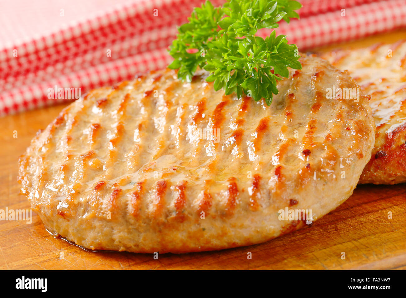 Pan fried burger patties on cutting board Stock Photo Alamy