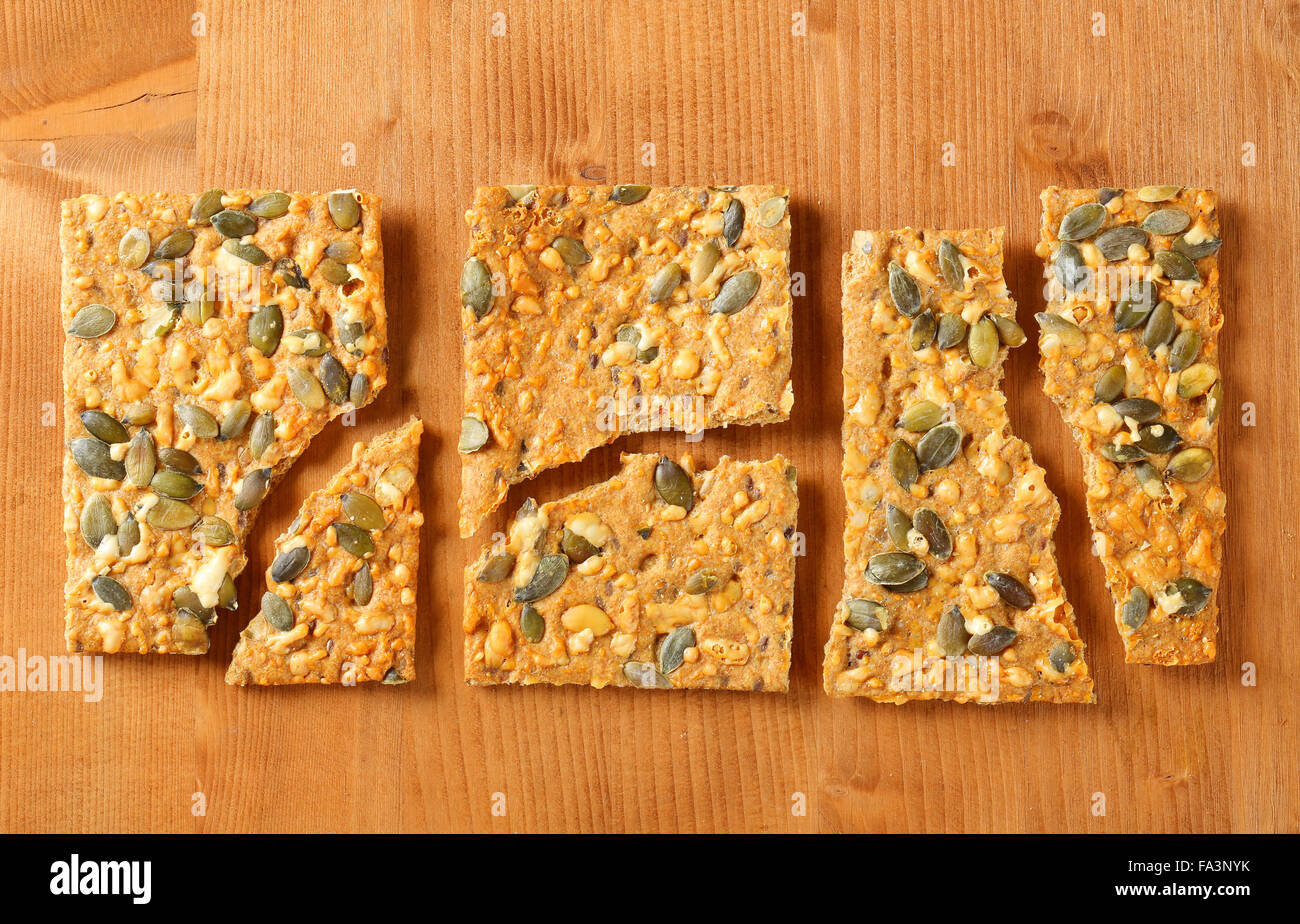 Whole grain crackers with cheddar and pepitas Stock Photo - Alamy