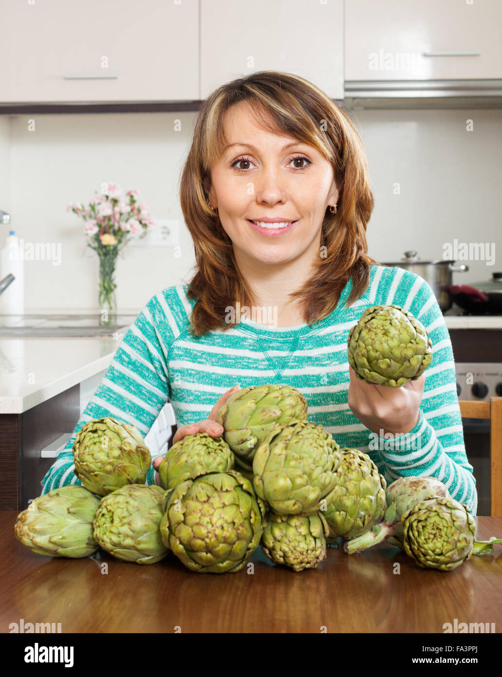 Woman vegetables artichokes kitchen hires stock photography and images