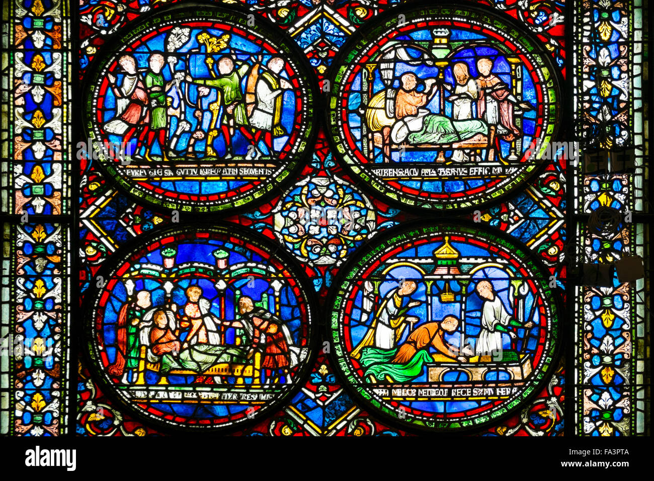 Medieval stained glass in Canterbury cathedral Stock Photo