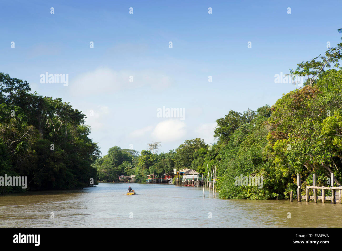 Boat on a creek in the Brazilian Amazon Stock Photo