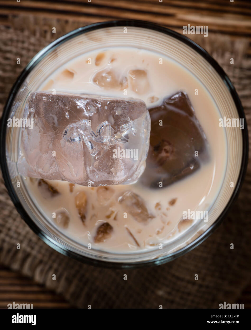 Irish Cream Liqueur (detailed close-up shot) on wooden background Stock Photo