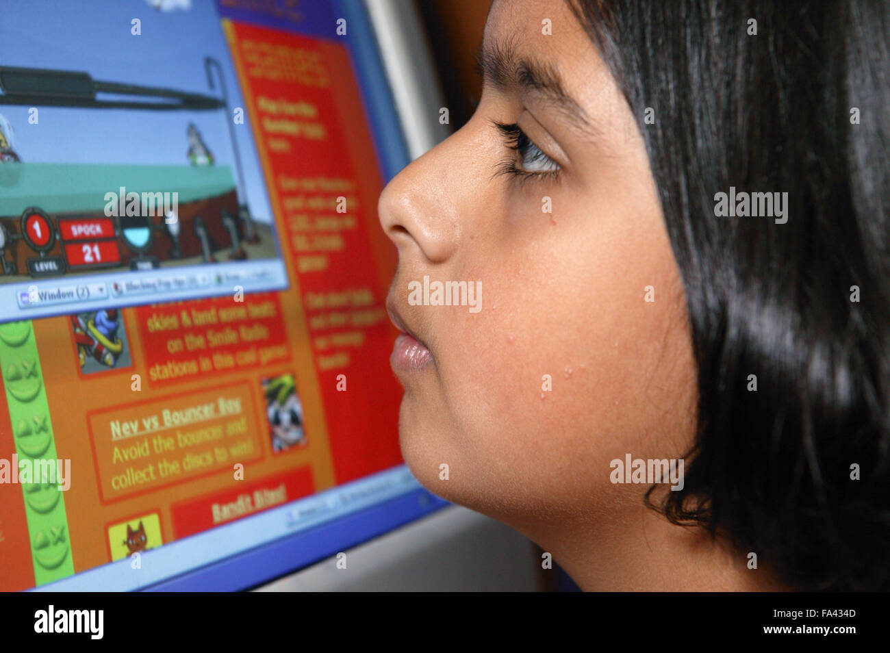 Lean Into Screen Portrait of girl leaning up to the screen of her computer Stock Photo ...