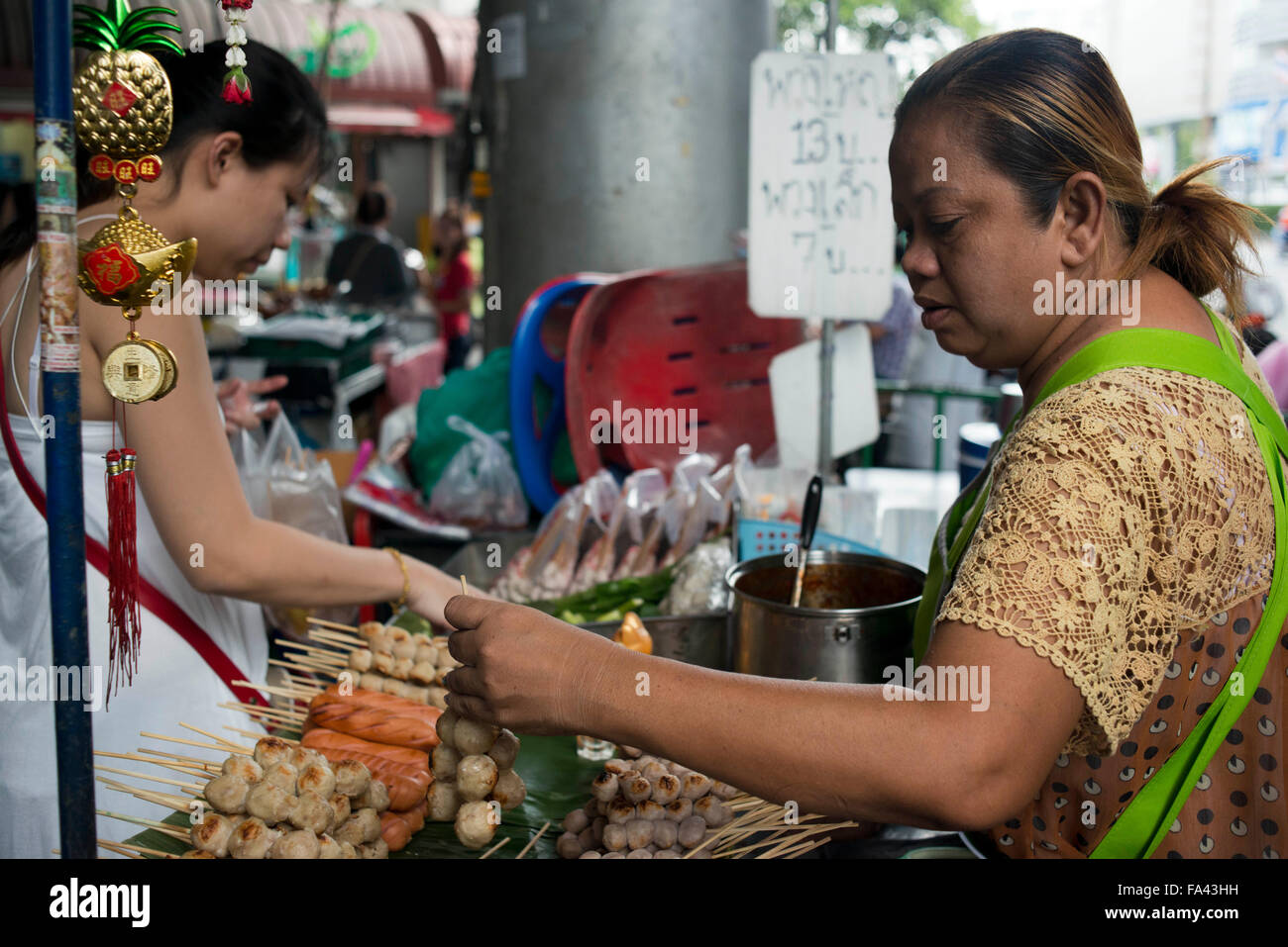 Market stall and street food being prepared in Chinatown Bangkok, Thailand. Yaowarat, Bangkok’s Chinatown, is the World’s most r Stock Photo