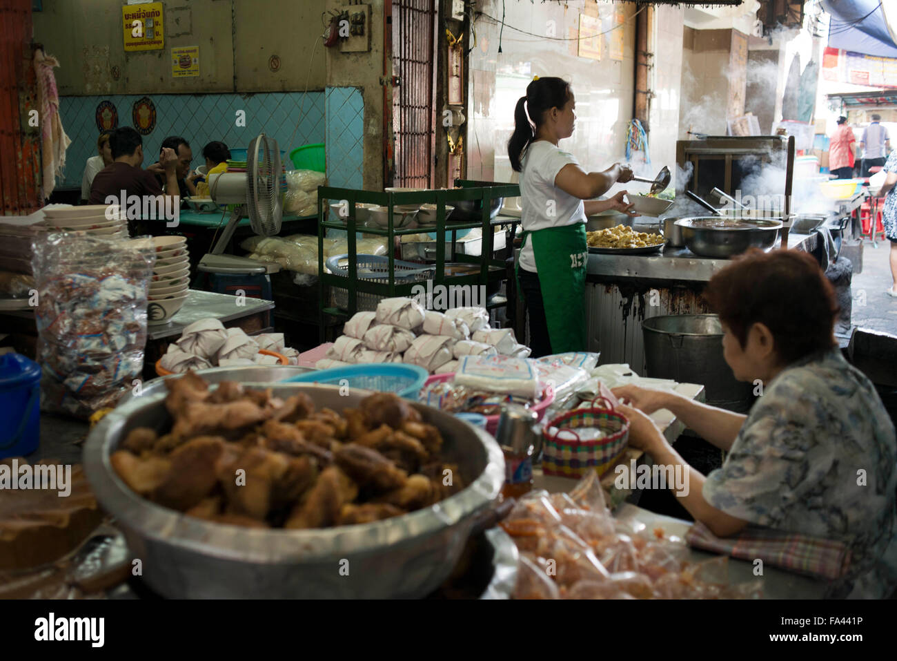 Market stall and street food being prepared in Chinatown Bangkok, Thailand. Yaowarat, Bangkok’s Chinatown, is the World’s most r Stock Photo