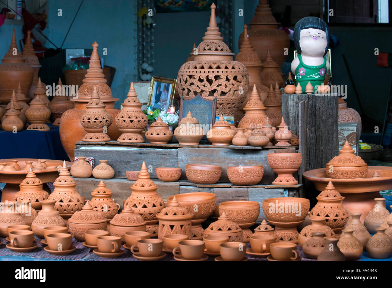 Ko Kred ceramics, Bangkok, Thailand. Potter turning clay vase on potters wheel at a craft