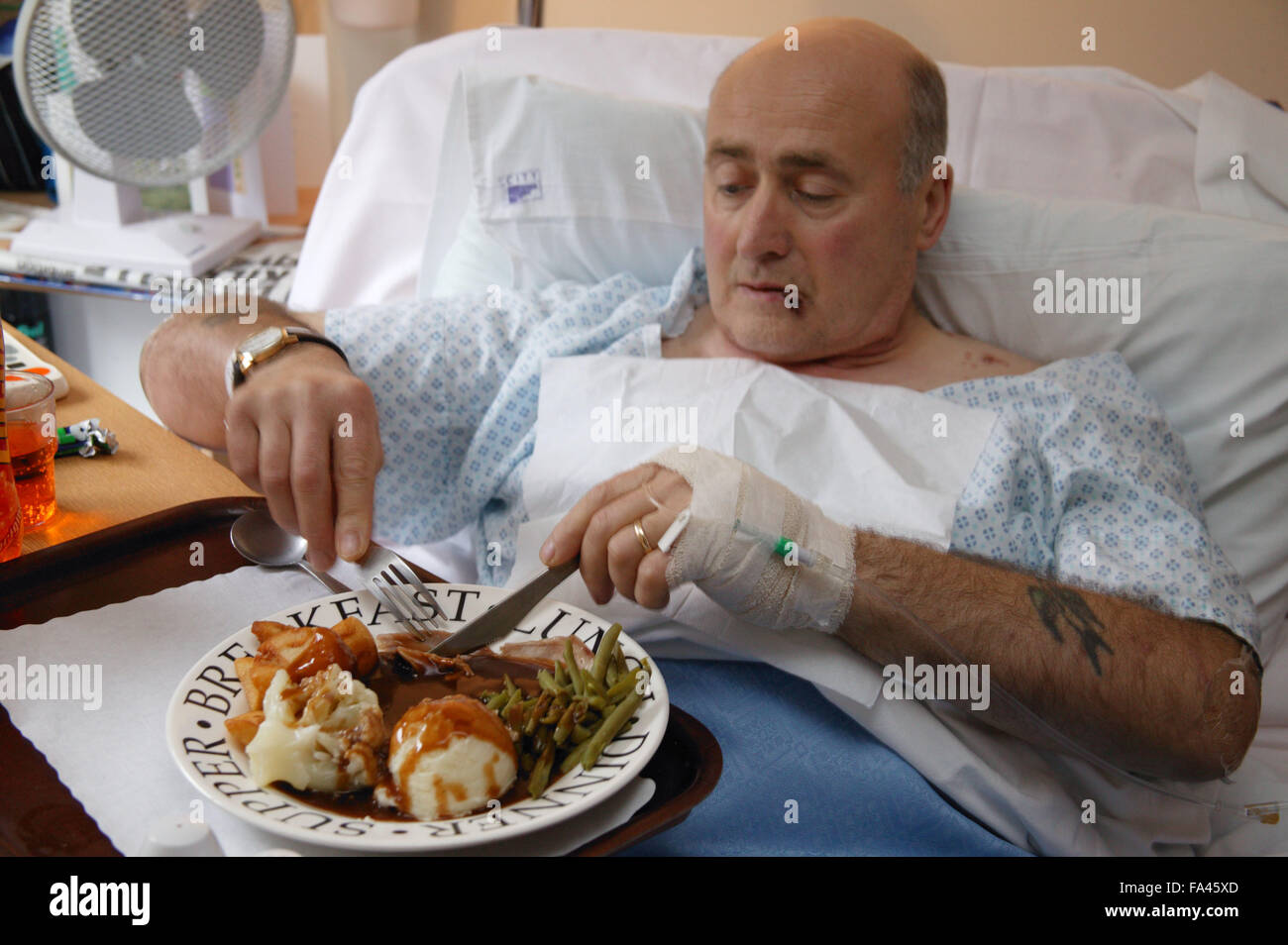 Hospital patient eating dinner Stock Photo Alamy