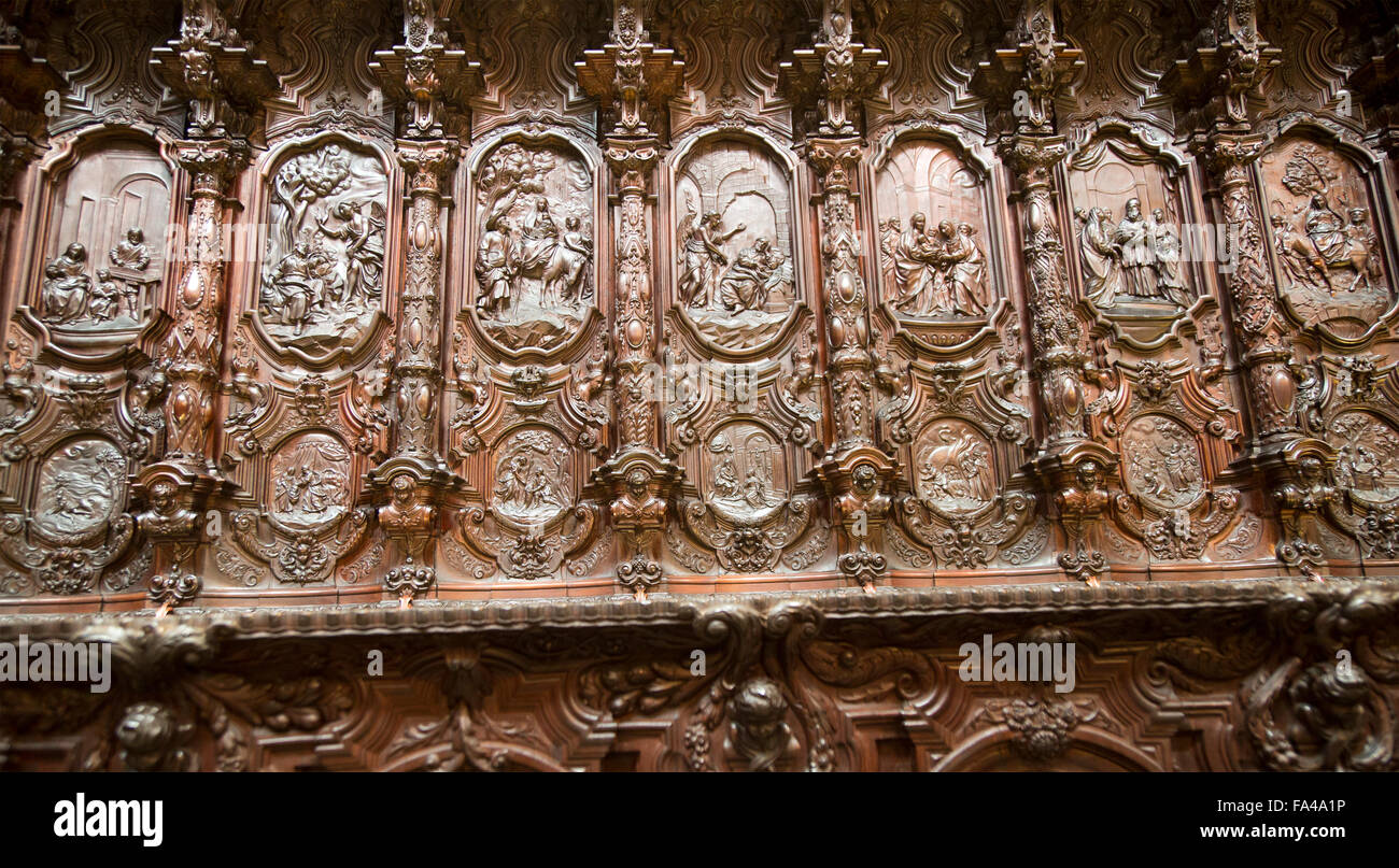 Finely carved mahogany woodwork in the cathedral choir stalls by Pedro Duque Cornejo, Cordoba, Spain Stock Photo
