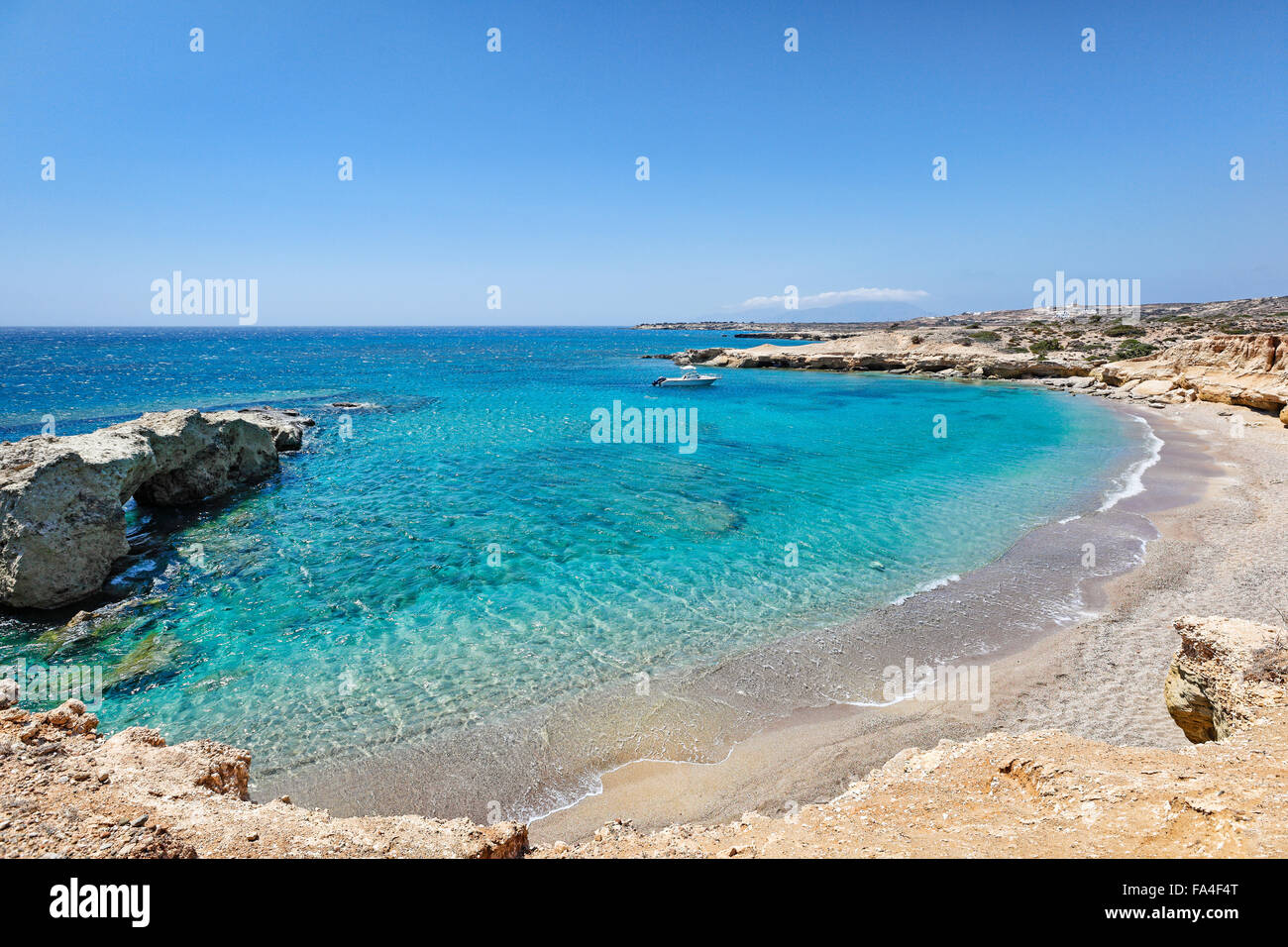 Michaliou Kipos beach with eaten by the sea cliffs and unique caves in Karpathos, Greece Stock Photo