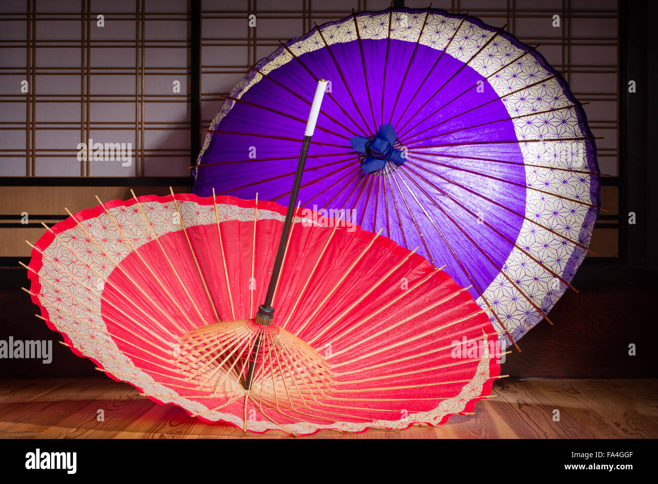Red and purple traditional Japanese paper umbrellas with an abstract