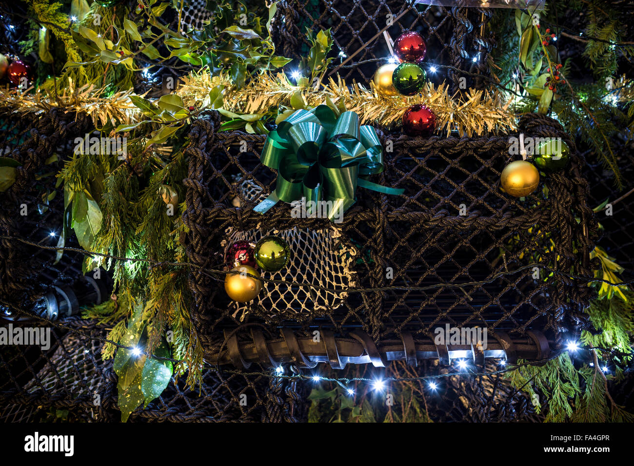 A Christmas tree constructed entirely from lobster pots glitters on the quayside in Emsworth