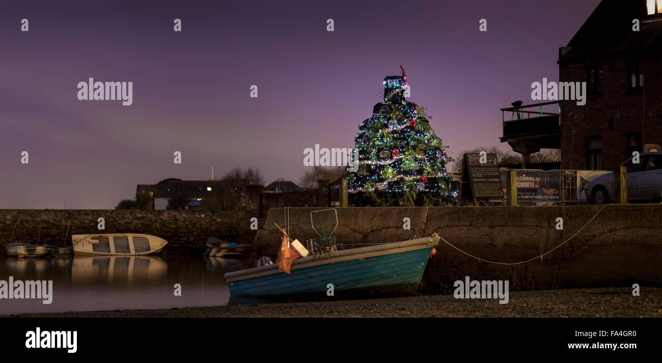 A Christmas tree constructed entirely from lobster pots glitters on the