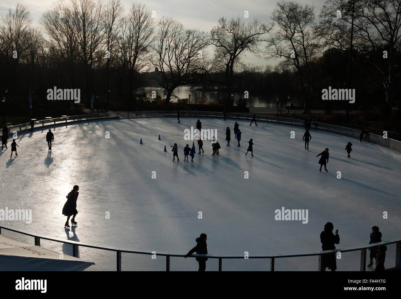 Silhouette of Ice skaters in Prospect Park Brooklyn New York Stock Photo
