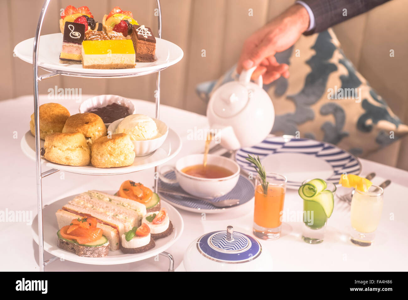 High tea is served in a restaurant with all the tradition trimmings ...