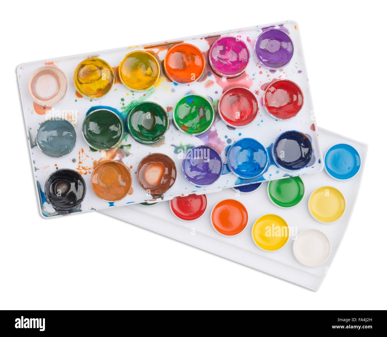 New and used watercolor paints in palette isolated on white background Stock Photo