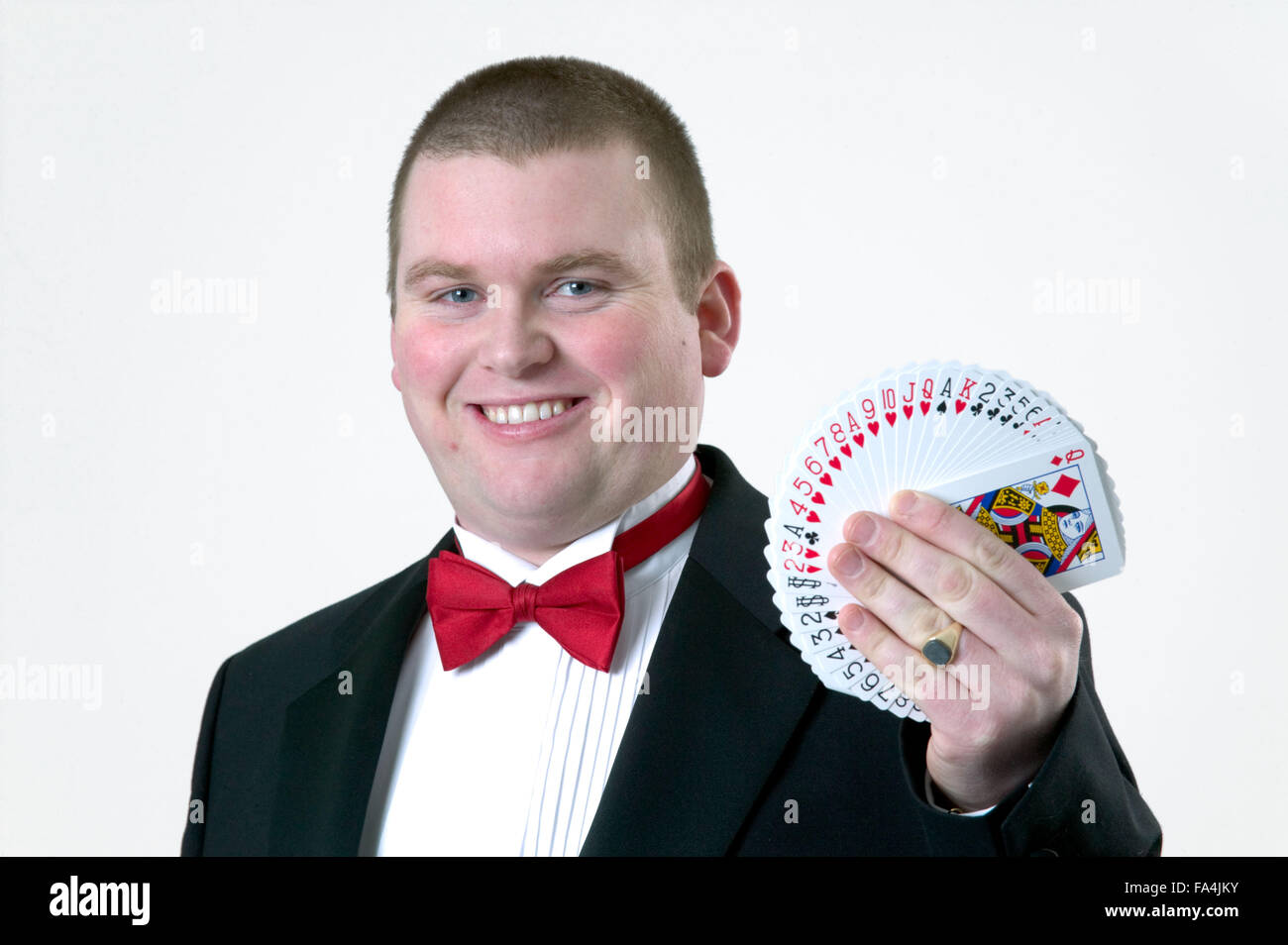Magician performing a magic trick with a pack of cards Stock Photo Alamy