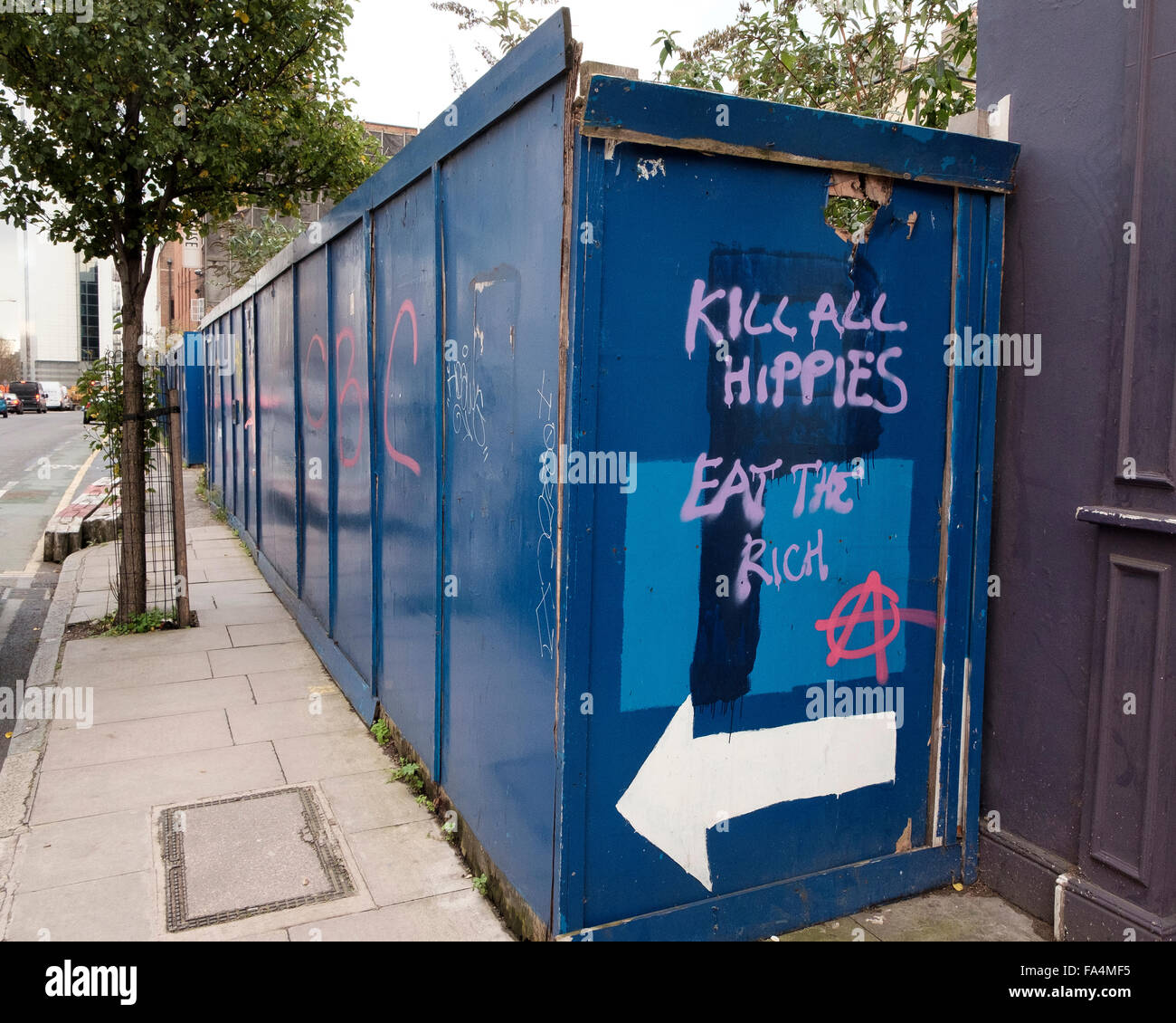 Leman Street, London, 25 November 2015: Kill all hippies, Eat the rich - Anti-Hipster slogan near Aldgate Stock Photo