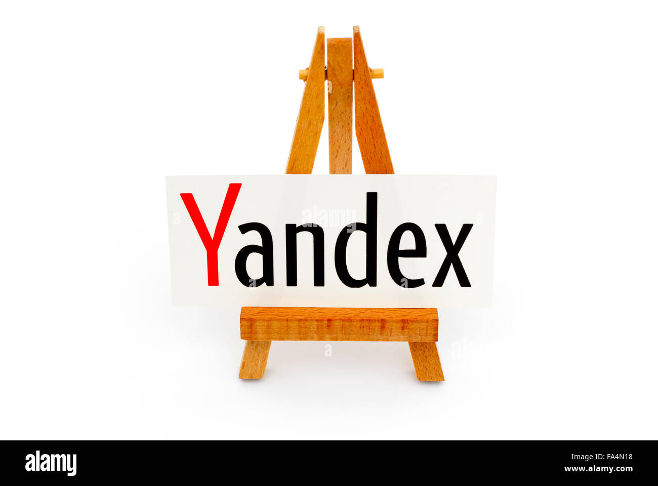 Tambov, Russian Federation - September 27, 2015 Wooden easel paper with word Yandex on it. White background. Studio shot. Stock Photo
