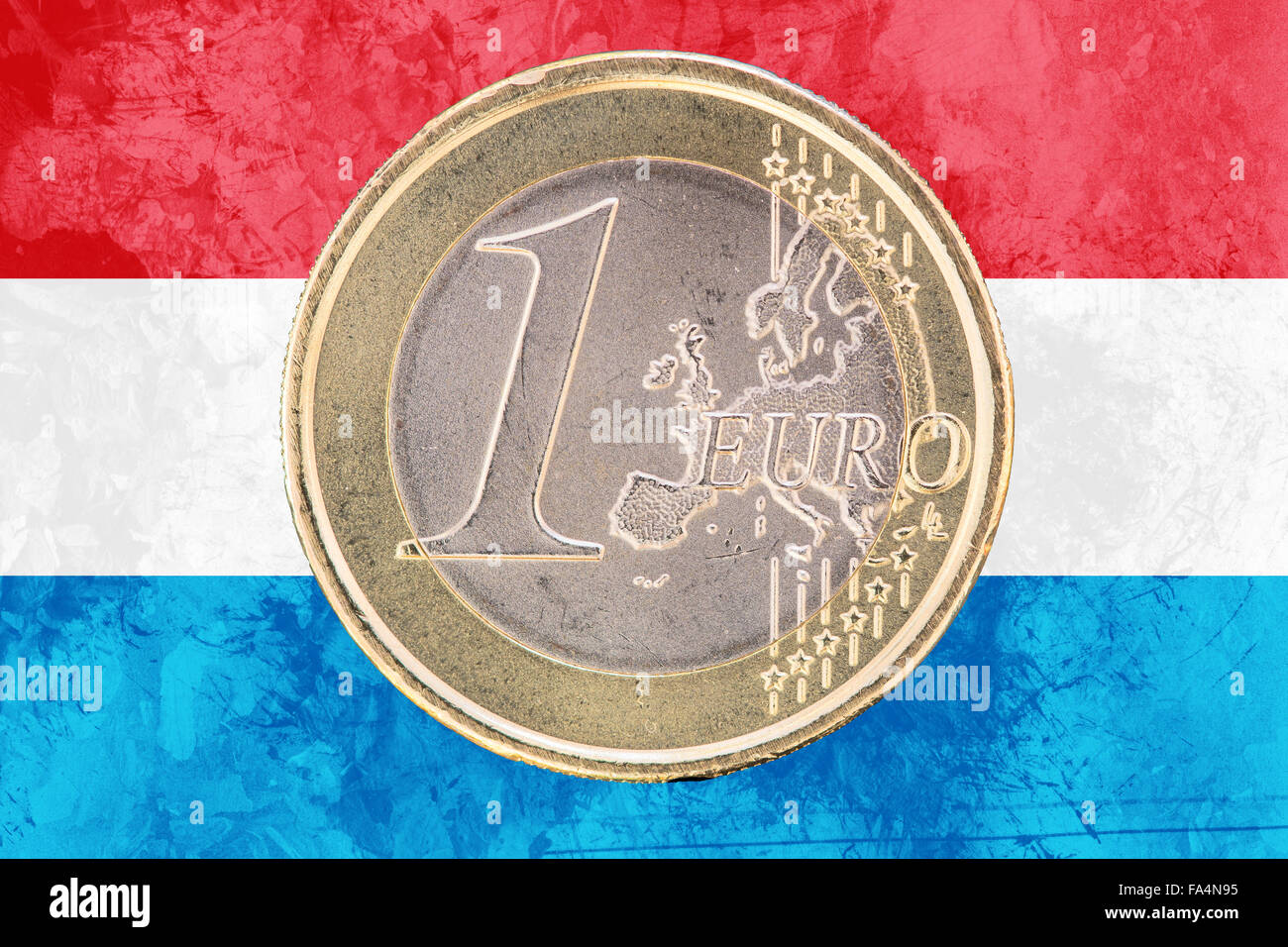 Common face of one euro coin from Luxembourg isolated on the national luxembourgish flag as background Stock Photo
