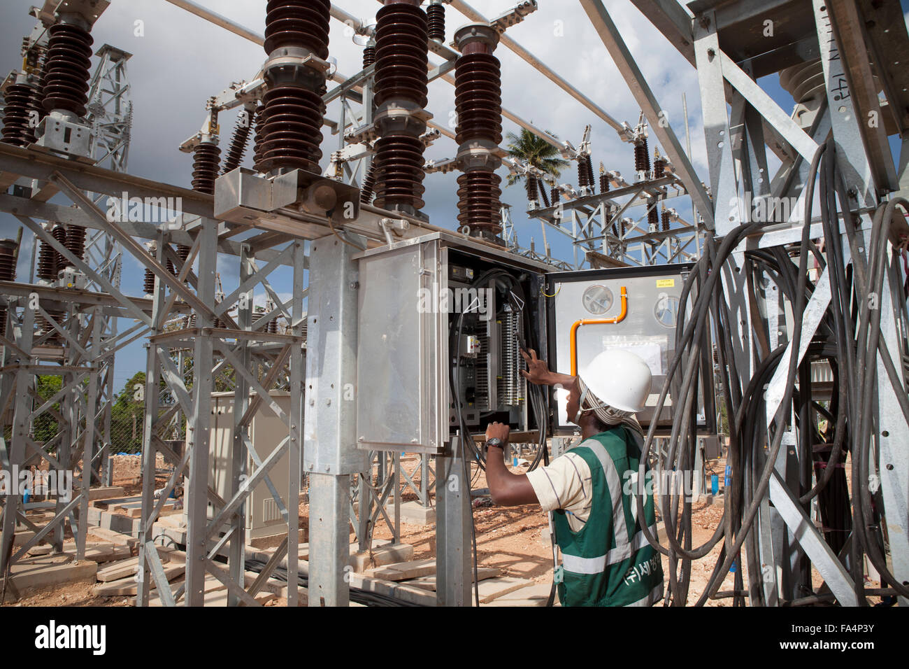 An electrical engineer maintains equipment at Mtoni Service Station in