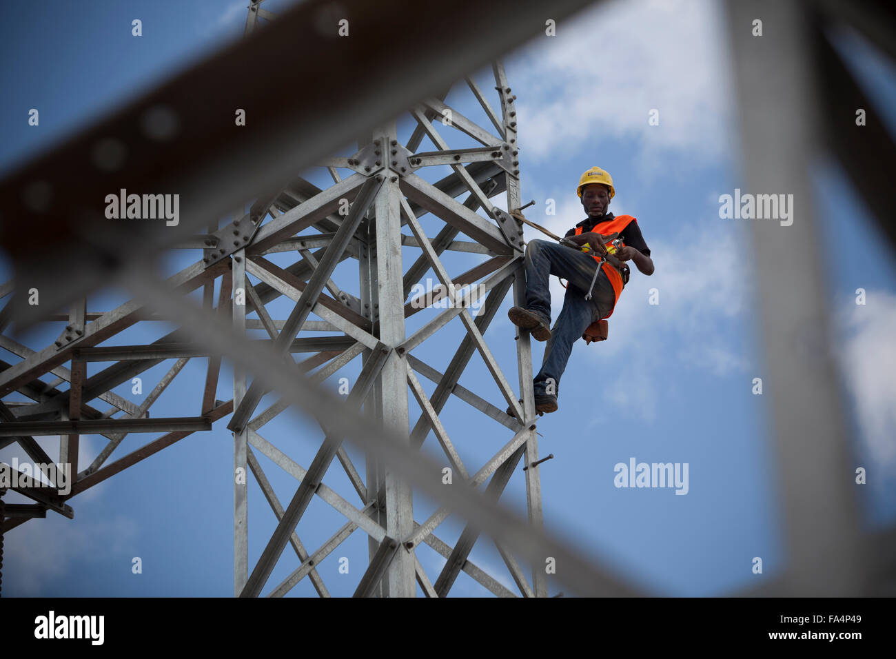 An electrical engineer maintains equipment at Mtoni Service Station in