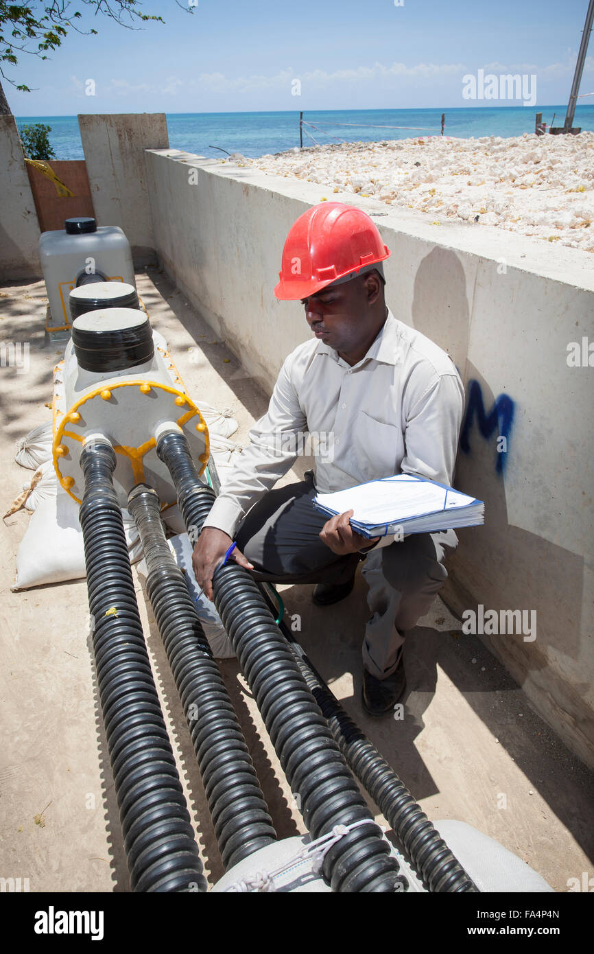 Under-sea power cable emerging on shores of Zanzibar from mainland, Tanzania, East Africa. Stock Photo