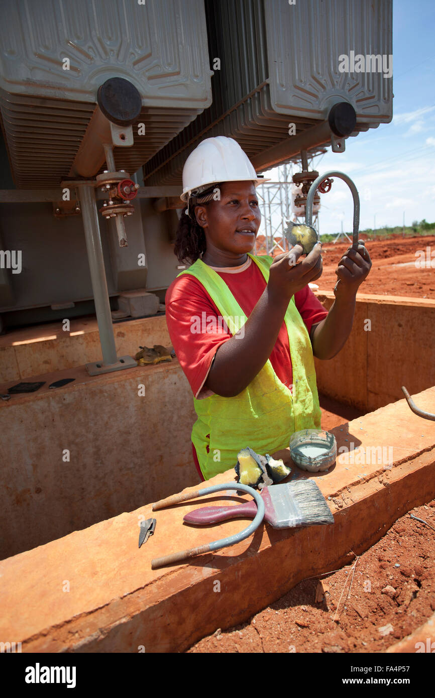 An electrical engineer assists in the construction of a new electrical substation in Tanga, Tanzania. Stock Photo